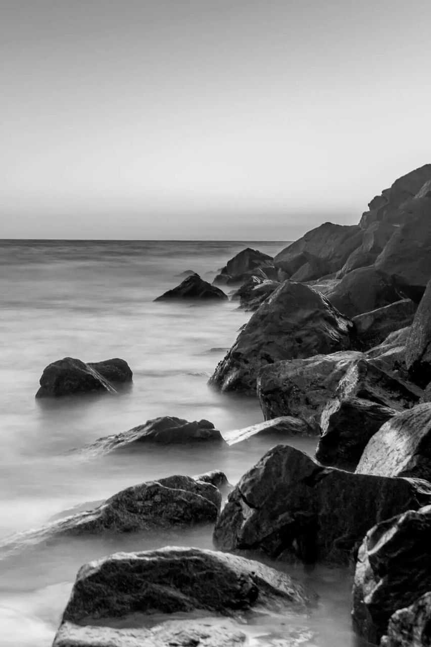 sea, water, horizon over water, scenics, rock - object, tranquil scene, beauty in nature, tranquility, rock formation, clear sky, nature, rock, copy space, idyllic, coastline, shore, sky, cliff, seascape, wave