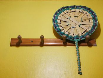 Close-up of toy on table against wall at home