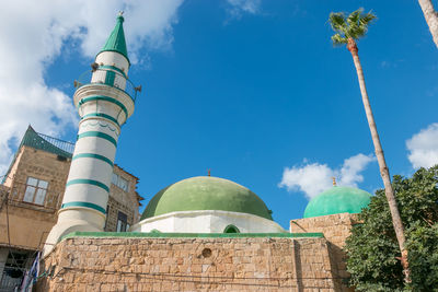 Low angle view of mosque against sky