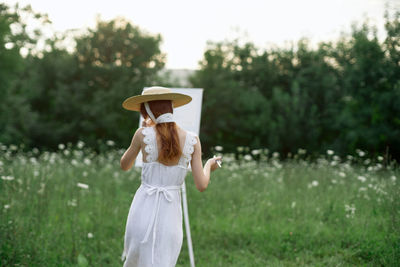 Full length of woman standing on field