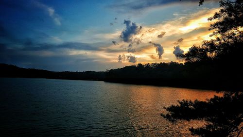 Scenic view of sea against cloudy sky