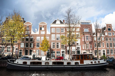 View of buildings against cloudy sky