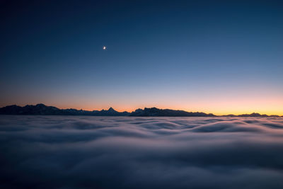 Scenic view of landscape against sky at night