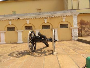 Bicycle parked against building