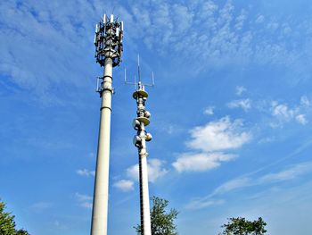 Low angle view of communications tower against sky