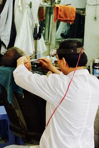 Barber working in saloon