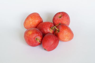 High angle view of apples on white background