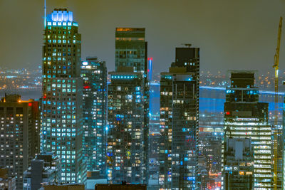 Illuminated buildings in city at night