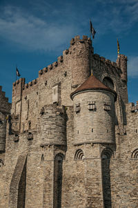 Stone wall and tower at the gravensteen castle in ghent. a city with gothic buildings in belgium.