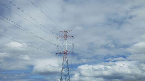 Low angle view of electricity pylon against sky