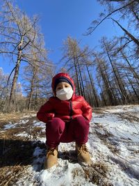 Full length of child on snow covered land