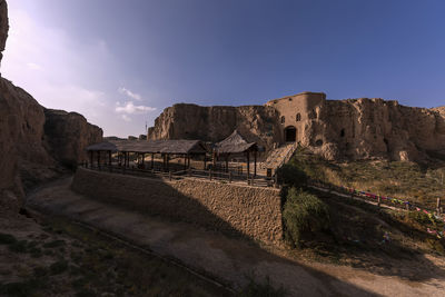 Panoramic view of rock formations against sky