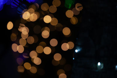 Defocused image of illuminated lights at night