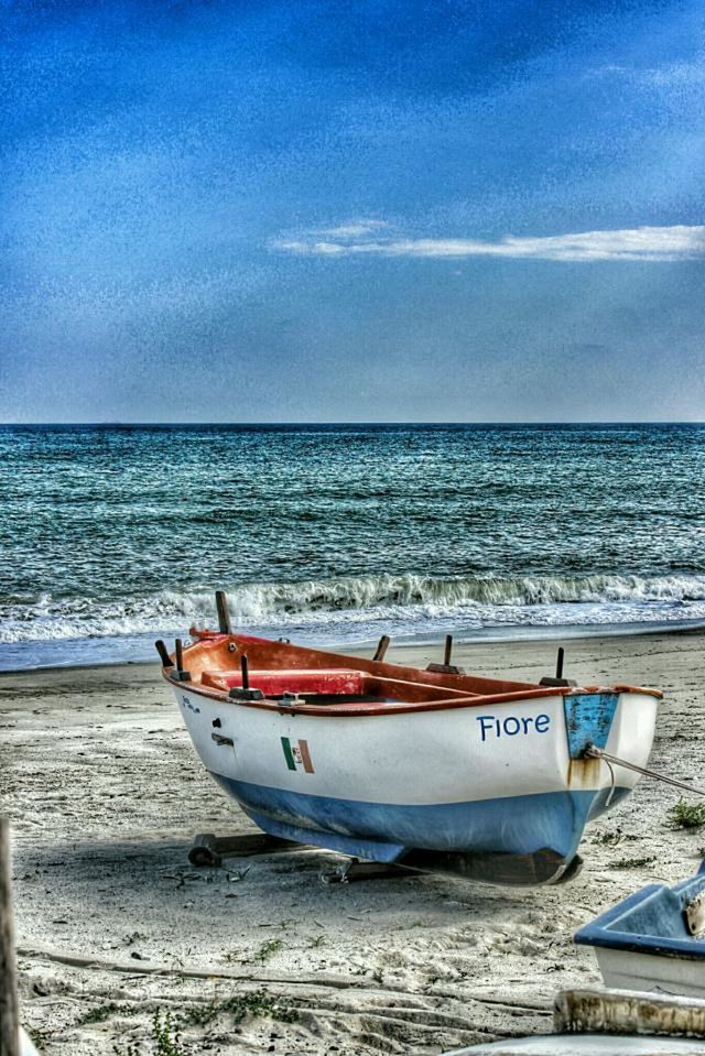 transportation, nautical vessel, mode of transport, boat, sea, water, horizon over water, moored, sky, beach, travel, blue, nature, tranquility, shore, beauty in nature, tranquil scene, scenics, day, outdoors