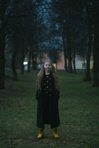 Full length of woman standing on field