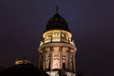 Low angle view of illuminated cathedral against sky at night