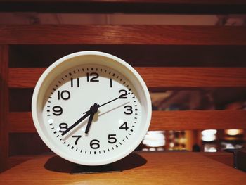 Close-up of clock on table