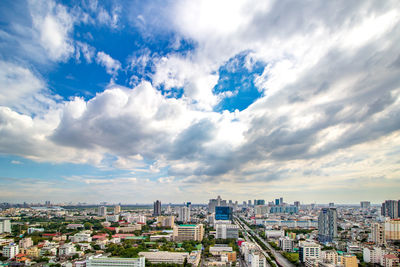 High angle view of buildings in city against sky