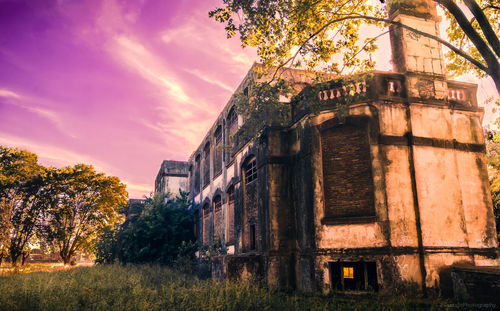 Low angle view of old building against sky