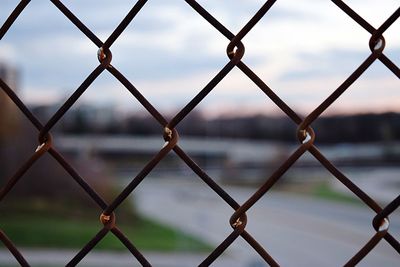 Full frame shot of chainlink fence against sky