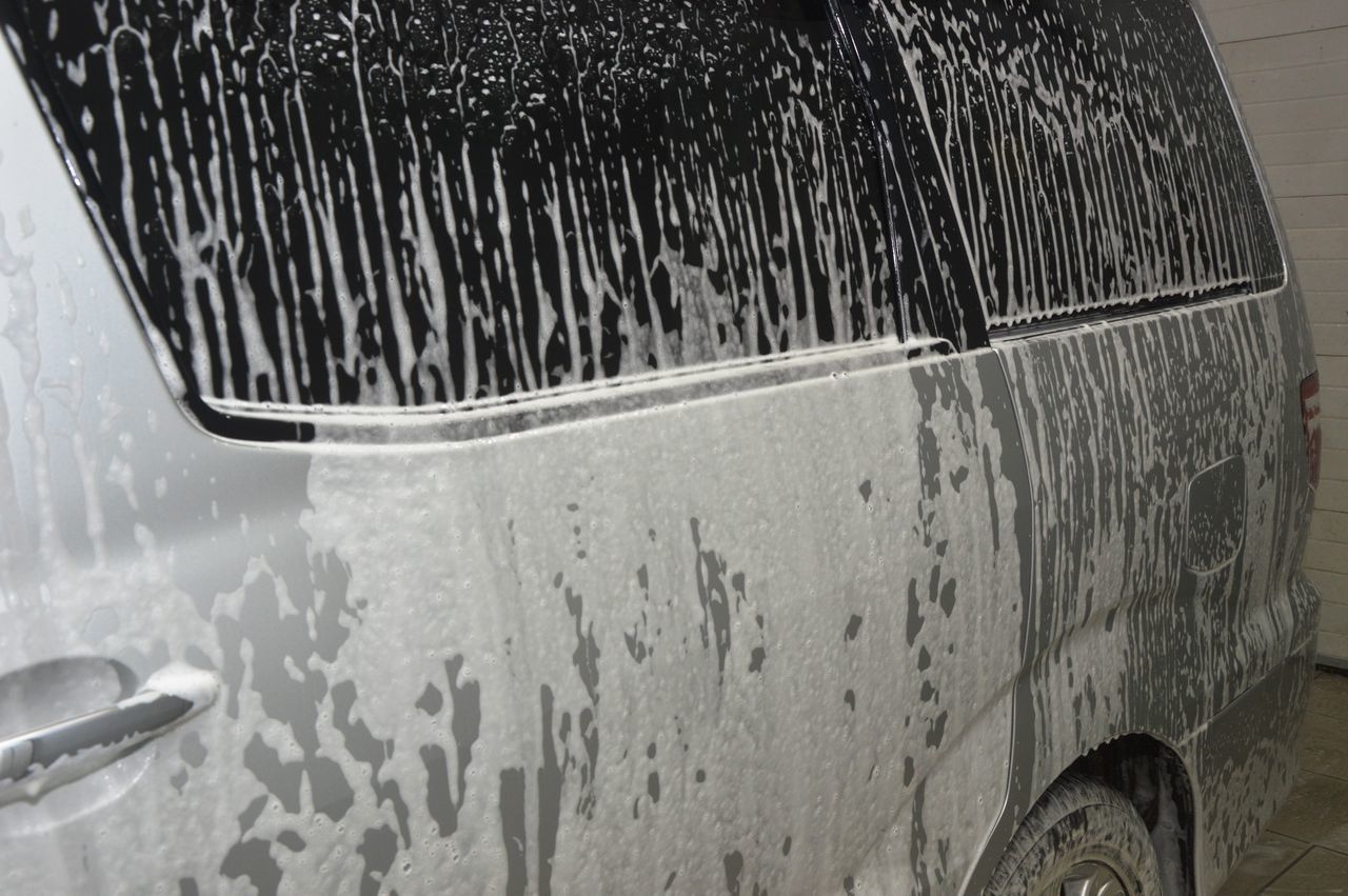 CLOSE-UP OF WET SNOW ON CAR