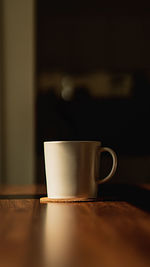 Close-up of coffee cup on table