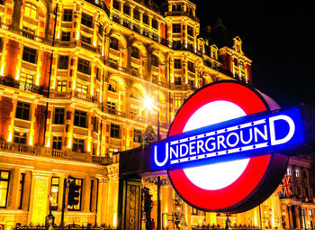 Information sign in city at night