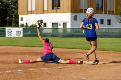 Full length of woman playing soccer