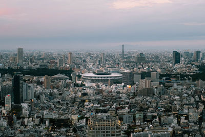 High angle view of modern buildings in city against sky. tokyo 2020 and 2021 stadium.