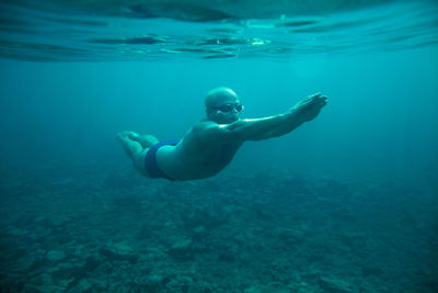 Man swimming in sea