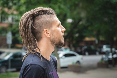 Side view of young man looking away