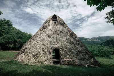 House on field against sky