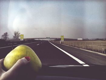 Road against cloudy sky