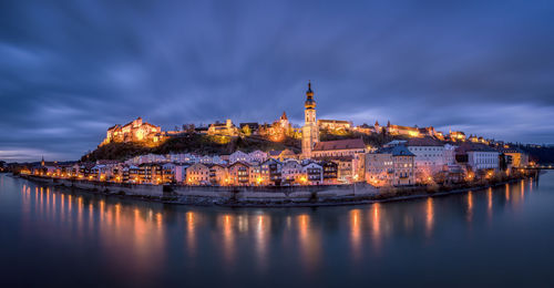 Illuminated buildings at waterfront