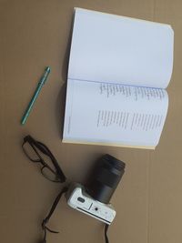 High angle view of pen and book on table