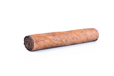 Close-up of cigarette against white background