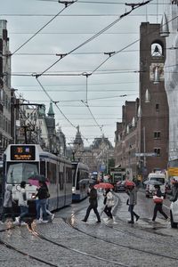 People walking on street in city