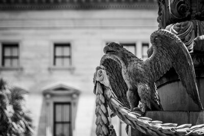 Low angle view of horse statue against building