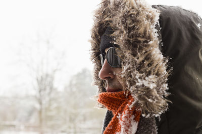 Close-up portrait of person in snow