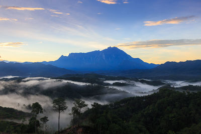 Scenic view of mountains against sky during sunset