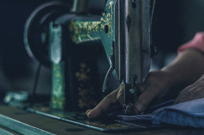 Cropped hand sewing textile using machinery