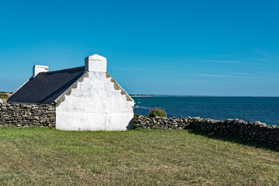 View of sea against clear blue sky