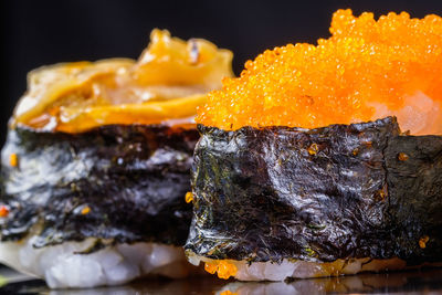 Close-up of orange fish on barbecue grill