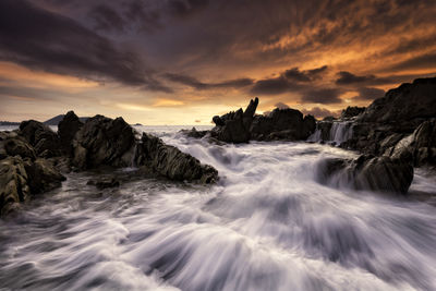 Scenic view of sea against sky during sunset