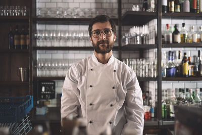 Portrait of confident male chef in commercial kitchen