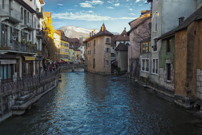 Canal amidst buildings in city