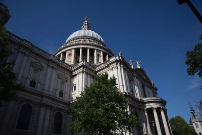 Low angle view of st pauls cathedral against clear sky in city