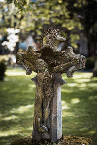 Close-up of cross on stone