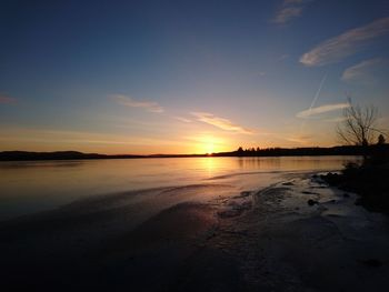 Scenic view of beach against sky during sunset