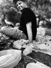 Rear view of couple sitting in yard